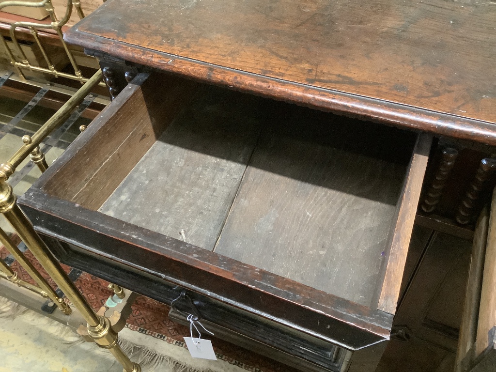 An early 18th century and later oak cupboard, with two frieze drawers, width 115cm